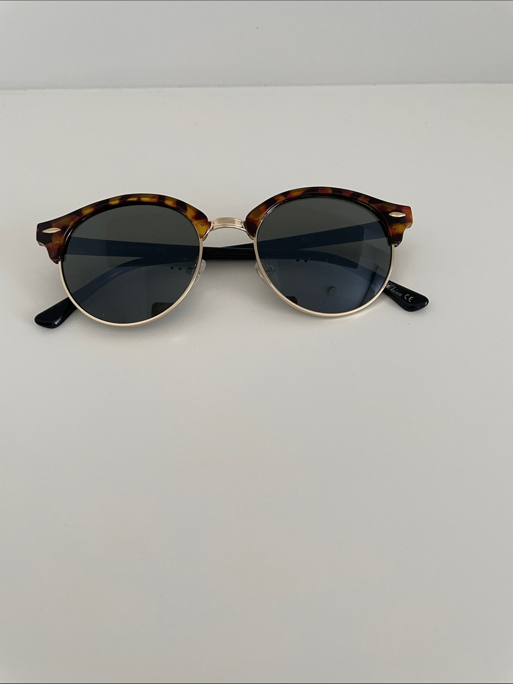 Tortoiseshell Round Sunglasses with Dark Lenses